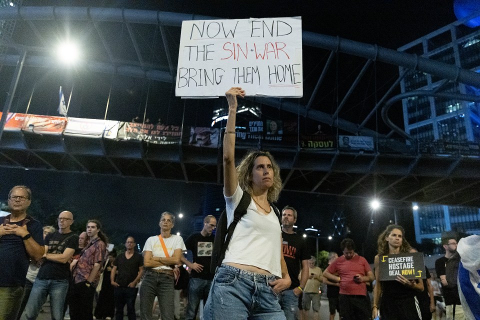 TEL AVIV, ISRAEL - OCTOBER 17: A protester holds a sign during a demonstration calling for an hostages deal on October 17, 2024 in Tel Aviv, Israel. The Hamas leader Yahya Sinwar was reportedly killed in an Israeli strike in Gaza on Thursday. Israel's Foreign Minister Israel Katz confirmed the news in a message to his global counterparts. Sinwar is widely thought to have organized the deadly attacks in Israel on October 7, 2023, and became leader of Hamas after the assassination of the group's previous leader, Ismail Haniyeh, in July. (Photo by Amir Levy/Getty Images)