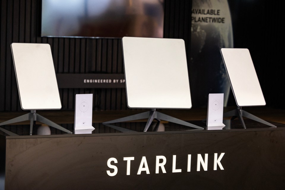 Three Starlink satellite antennas on display.