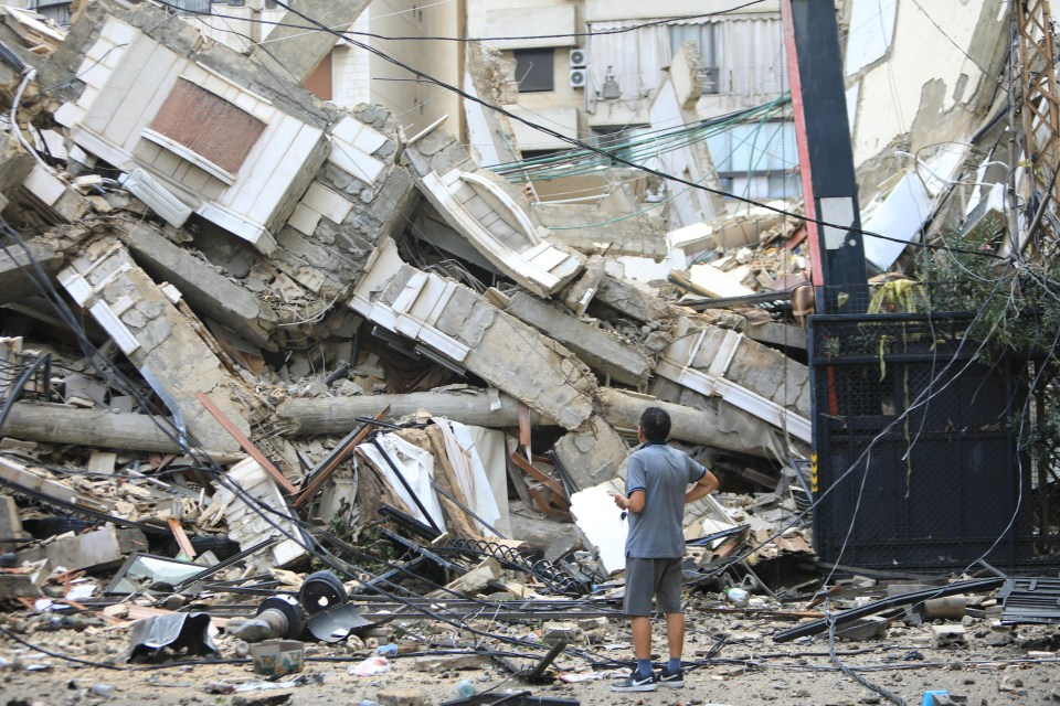A man looks at the destruction at the site of an overnight Israeli airstrike on the Ruwais neighbourhood in Beirut's southern suburbs on October 1, 2024. (Photo by AFP) (Photo by -/AFP via Getty Images)
