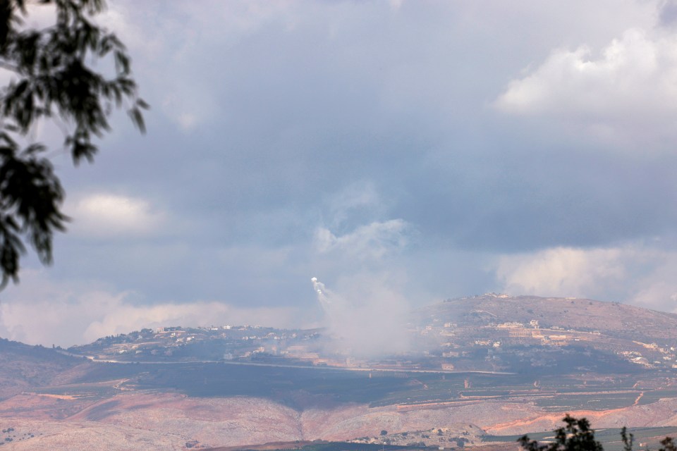 A picture taken from northern Israel along the border with southern Lebanon shows smoke billowing above the Lebanese village of Adaisseh during Israeli bombardment on October 1, 2024. (Photo by Jalaa MAREY / AFP) (Photo by JALAA MAREY/AFP via Getty Images)