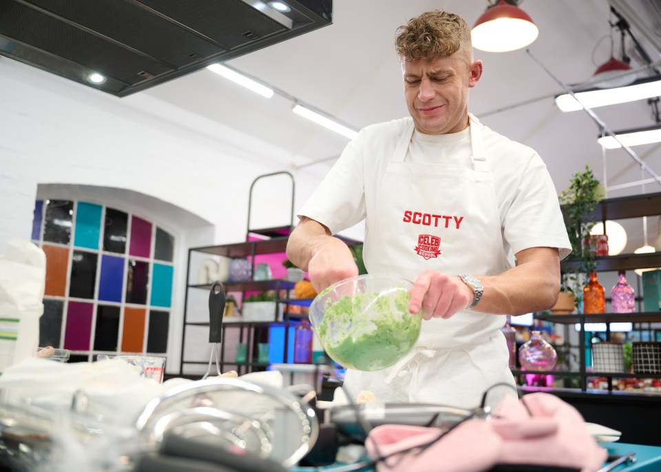 a man wearing an apron that says scotty on it