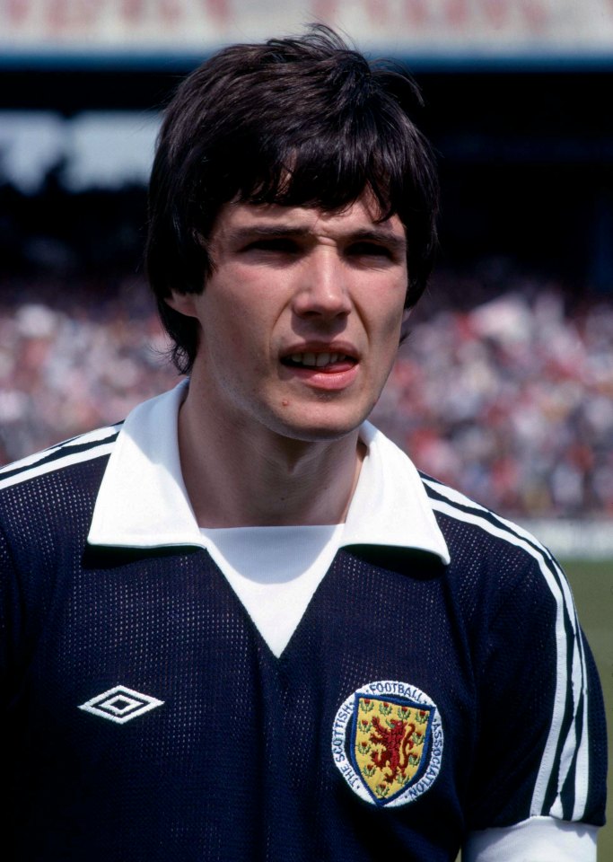 a man wearing a jersey that says ' scotland ' on it