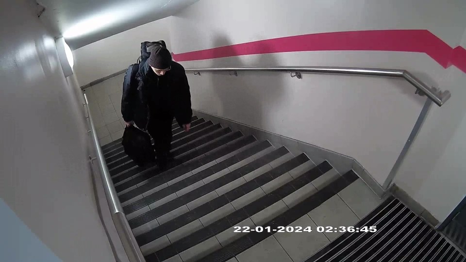 a man is walking up a set of stairs on 22-01-2024
