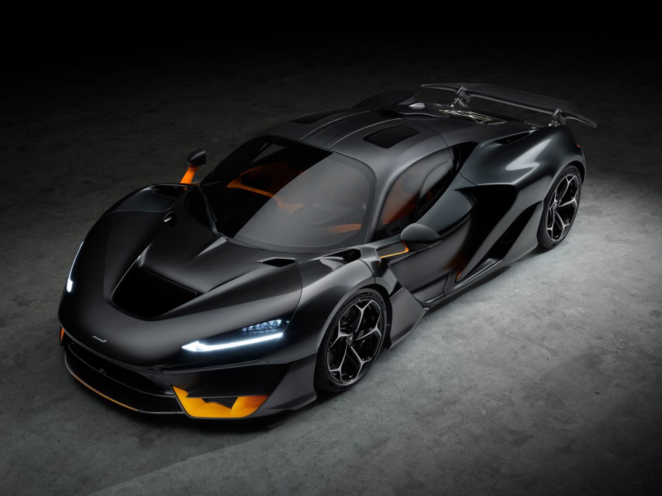a black and orange sports car with the word mclaren on the front