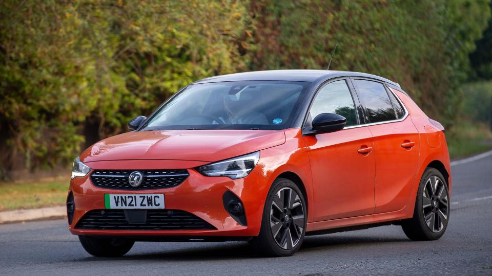 an orange car with a license plate that says vw21zwc
