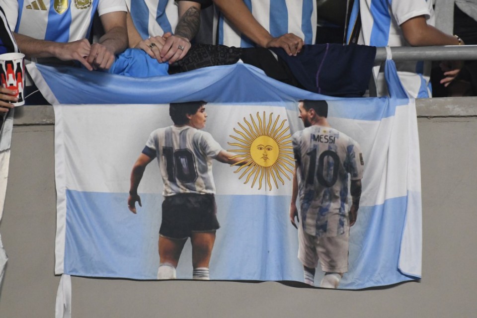 Mandatory Credit: Photo by Federico Peretti/NurPhoto/REX/Shutterstock (14788591m) The flag of Diego Maradona and Lionel Messi of Argentina is displayed during a match between Argentina and Bolivia at Estadio Mas Monumental Antonio Vespucio Liberti in Buenos Aires, Argentina, on October 15. Argentina v Bolivia - FIFA World Cup 2026 Qualifier, Buenos Aires - 15 Oct 2024