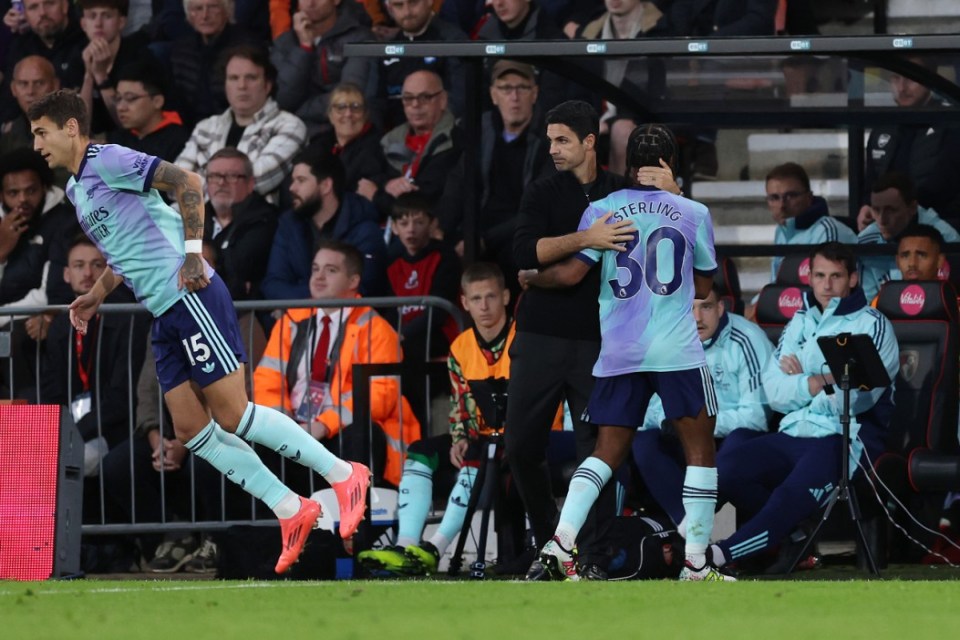 Arsenal manager Mikel Arteta (centre right) embraces Raheem Sterling after he is substituted for Jakub Kiwior (left) during the Premier League match at the Vitality Stadium, Bournemouth. Picture date: Saturday October 19, 2024. PA Photo. See PA story SOCCER Bournemouth. Photo credit should read: Steven Paston/PA Wire. RESTRICTIONS: EDITORIAL USE ONLY No use with unauthorised audio, video, data, fixture lists, club/league logos or "live" services. Online in-match use limited to 120 images, no video emulation. No use in betting, games or single club/league/player publications.