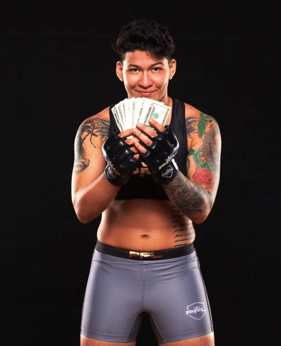 a female fighter holds a bunch of money in her hands