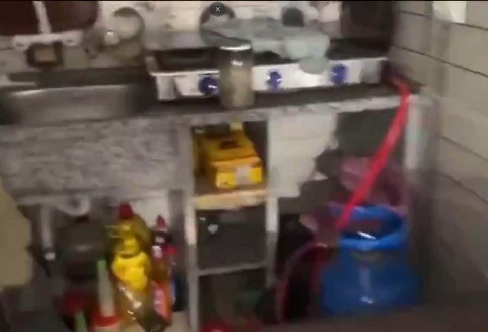 a kitchen with a sink , stove , and microwave .