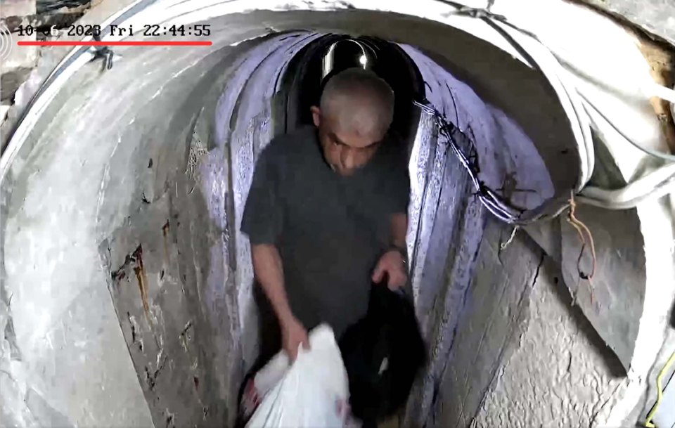 a man is walking through a tunnel with a time of 22:44:55
