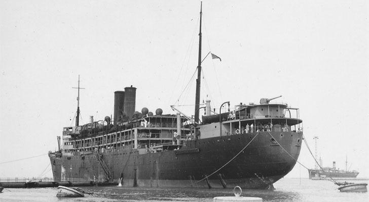 a black and white photo of a large ship in the water