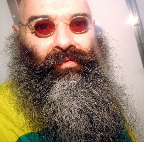 a man with a beard and mustache wearing sunglasses