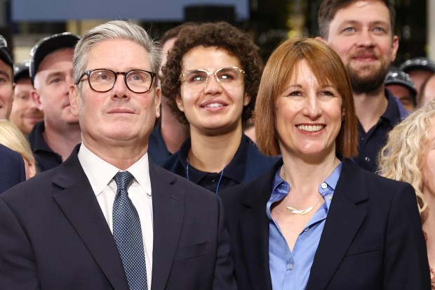 a group of people standing in front of a sign that says great western group