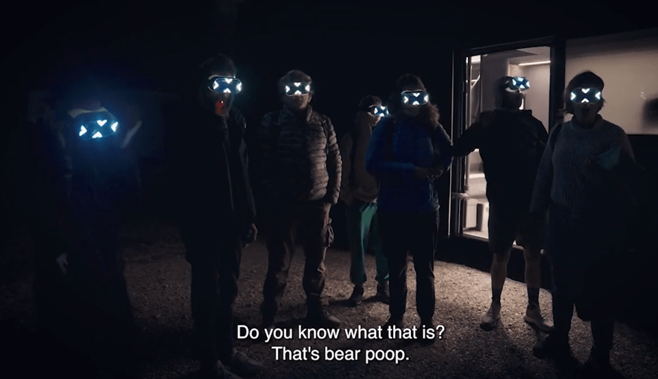 a group of people wearing glowing masks with the words do you know what that is that 's bear poop