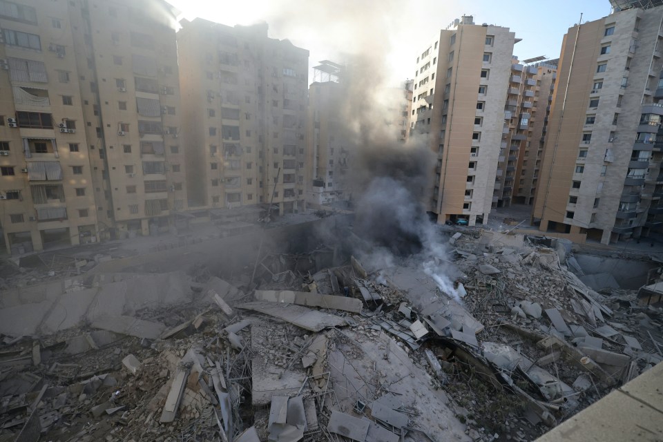 smoke is coming out of a hole in a building