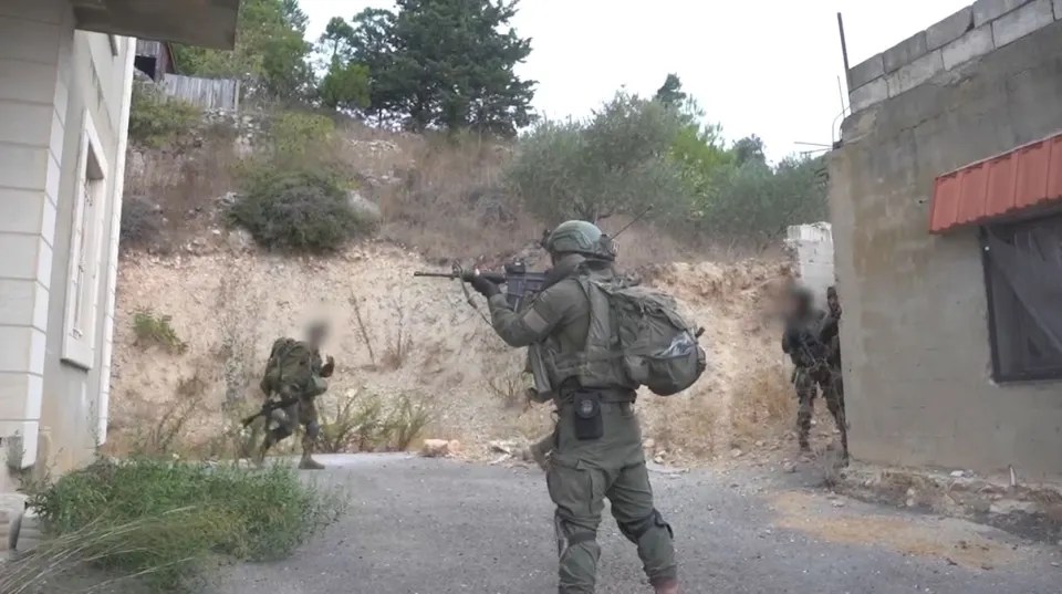 Another clip shows troops during the day searching a Hezbollah post Credit: IDF