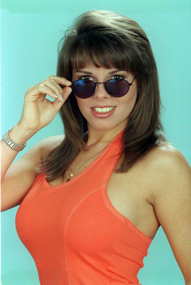 a woman wearing sunglasses and an orange tank top