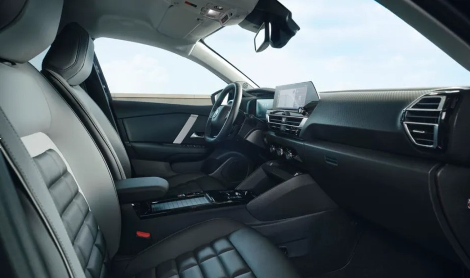 the interior of a car with a steering wheel and dashboard