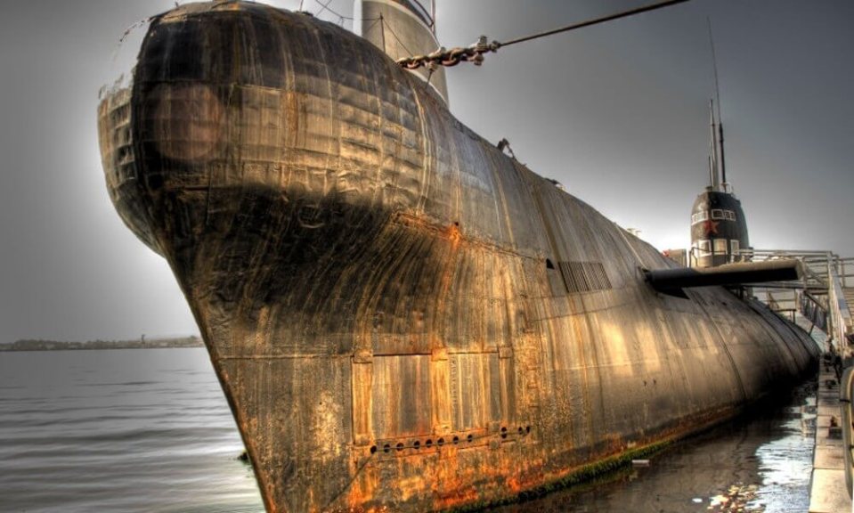 a very old submarine is sitting in the water