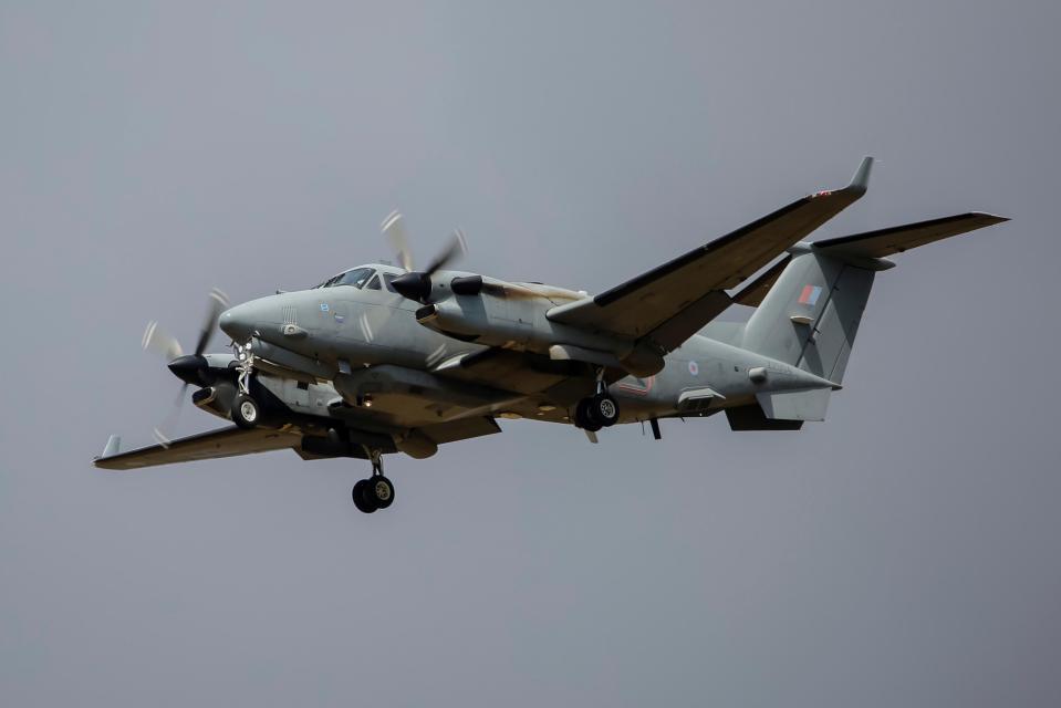 a military plane with the letter k on the tail