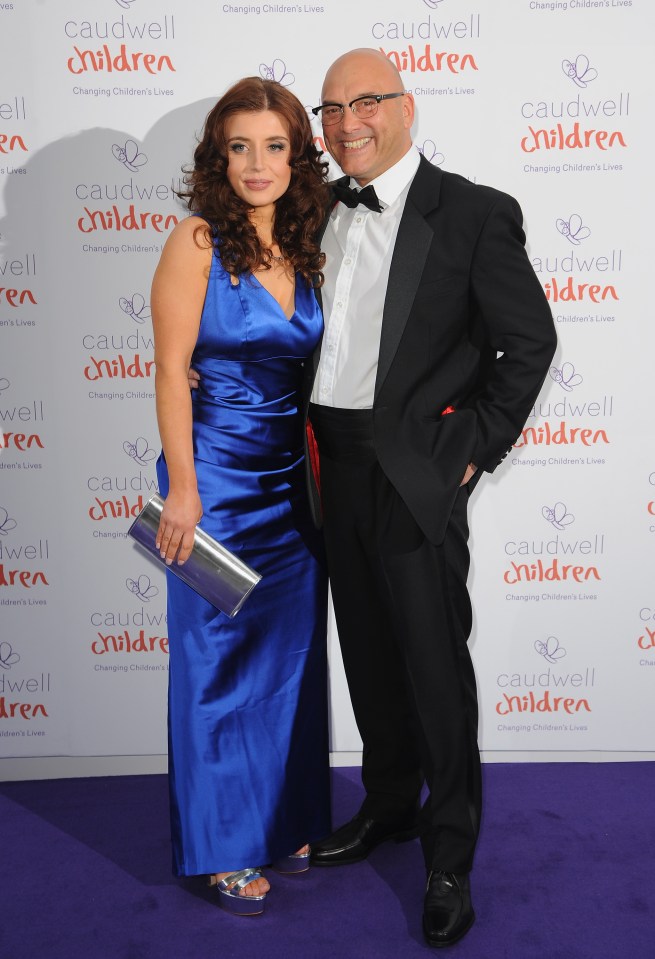 a man and woman pose for a photo in front of a wall that says caudwell children