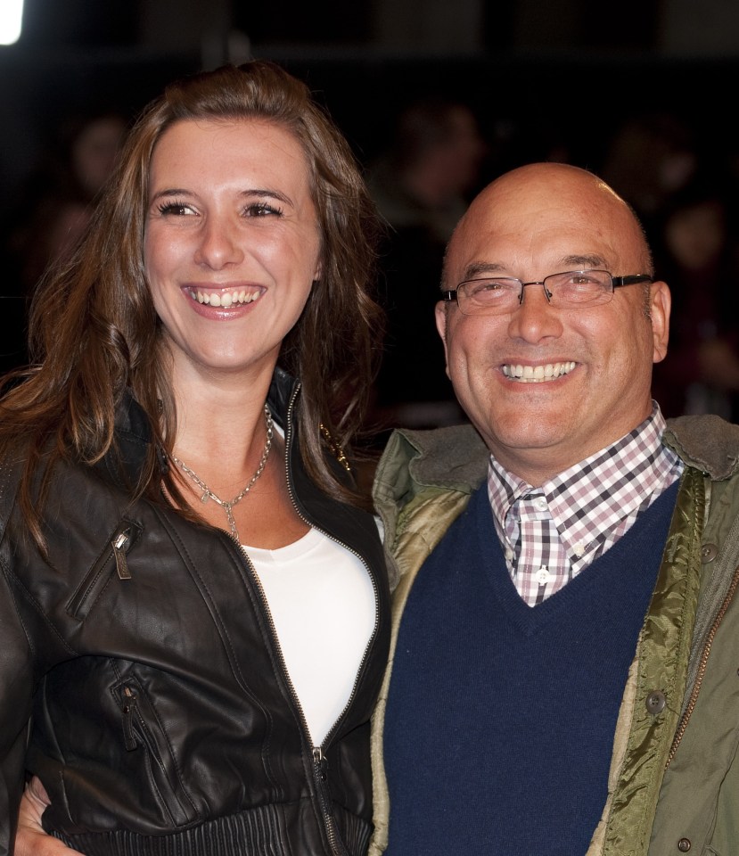 a man and a woman are posing for a picture and smiling