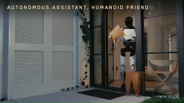 a robot is standing in front of a door holding a piece of paper .