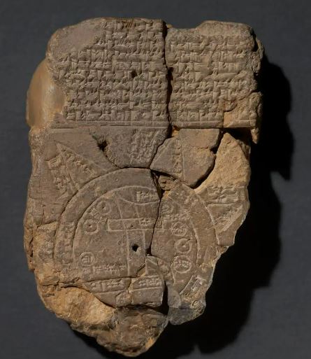a piece of stone with a drawing of a map on it .