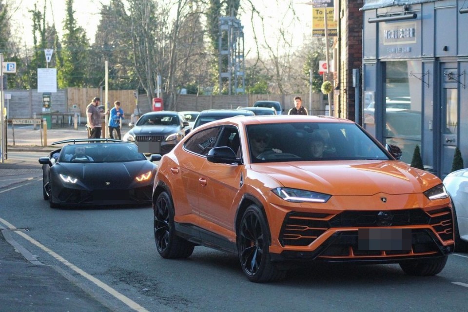 an orange car with a license plate that says gi4rry