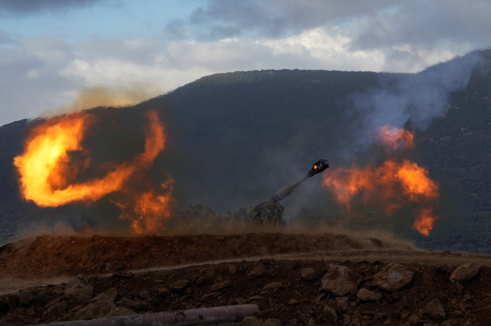 a cannon is being fired with flames coming out of it