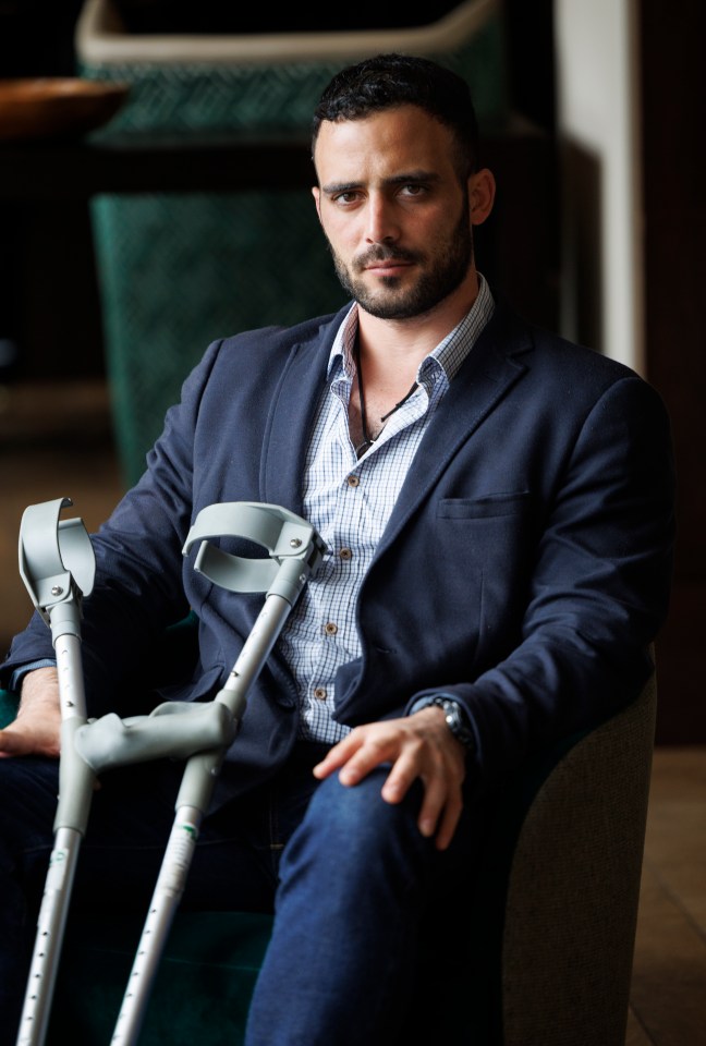 a man with a beard is wearing a blue jacket