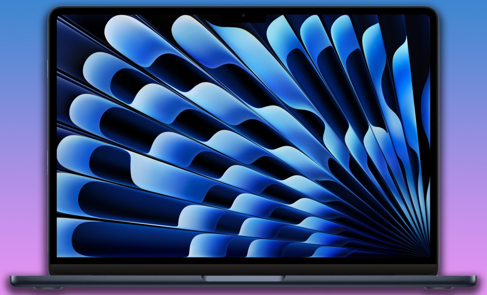 a laptop with a blue fan design on the screen