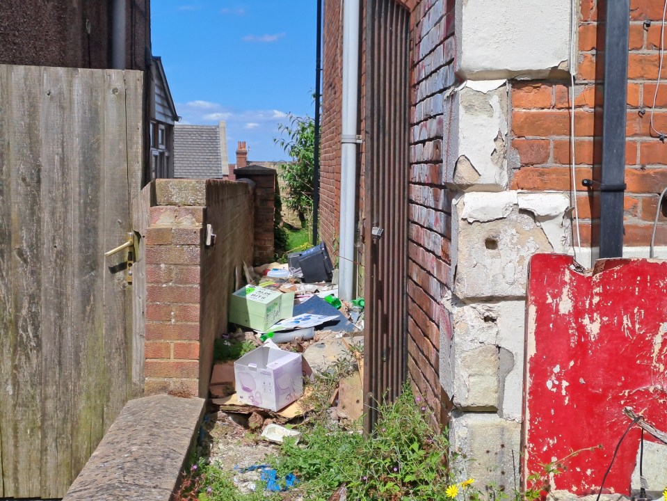 a brick wall with a red sign on it