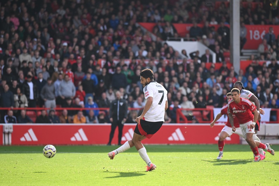 a soccer player with the number 1 on his jersey kicks the ball