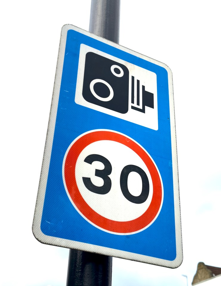 a blue and white sign that says 30 on it