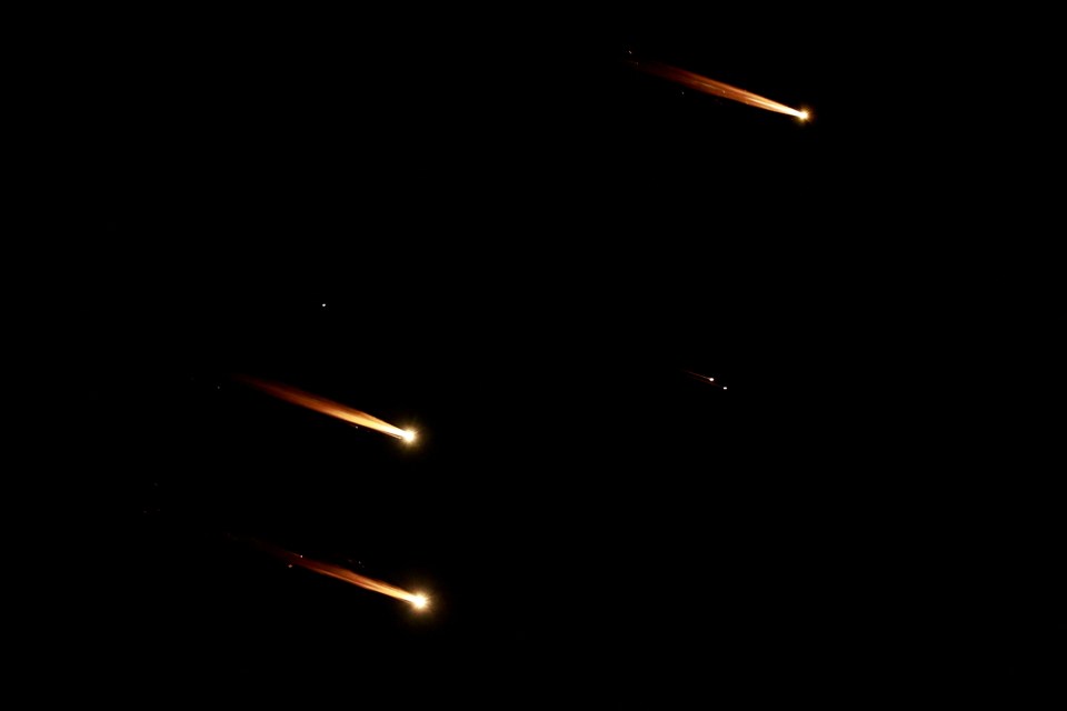 Rockets fly in the sky after Iran fired a salvo of ballistic missiles at Israel