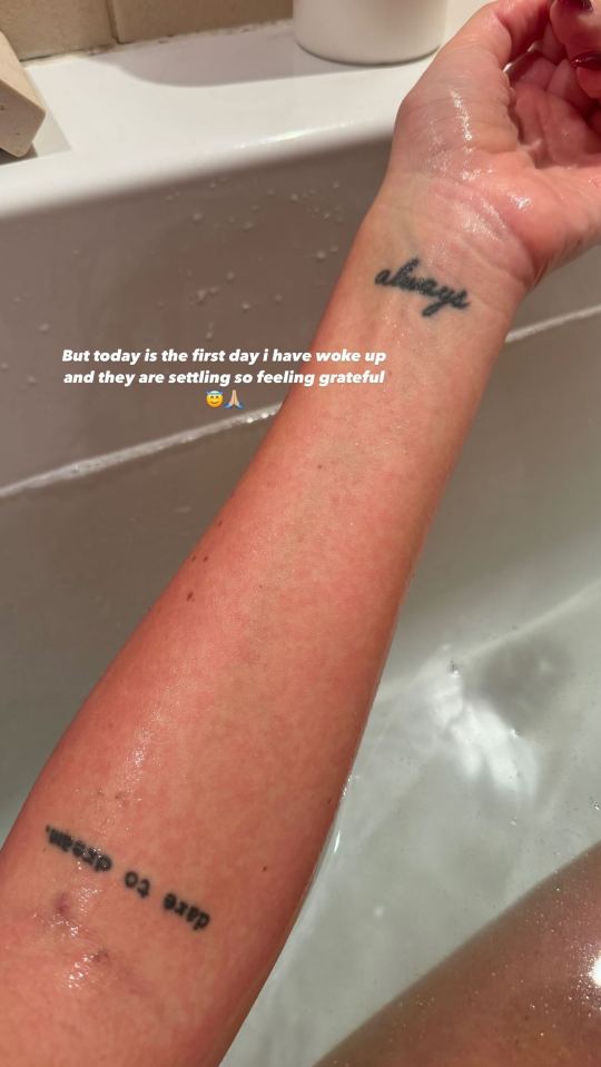 a woman 's arm with a tattoo that says always on it