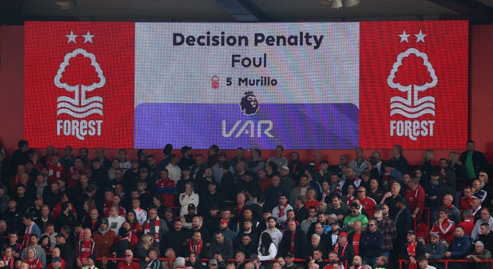 a large screen displays the decision penalty for foul