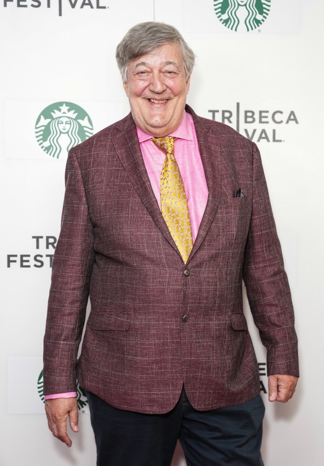 a man in a suit and tie poses in front of a starbucks sign