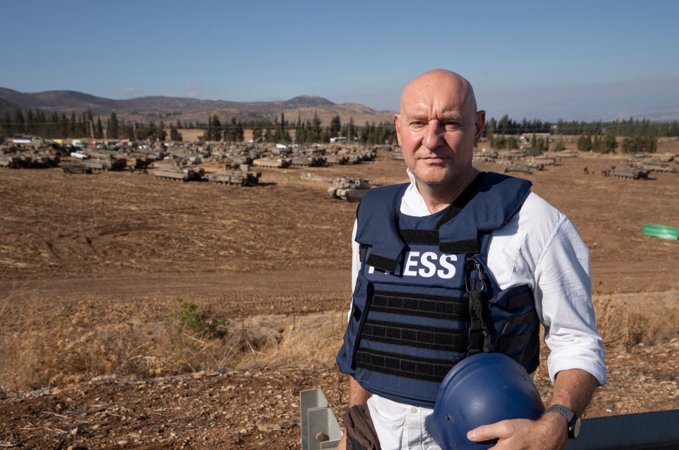 a man wearing a vest that says press on it