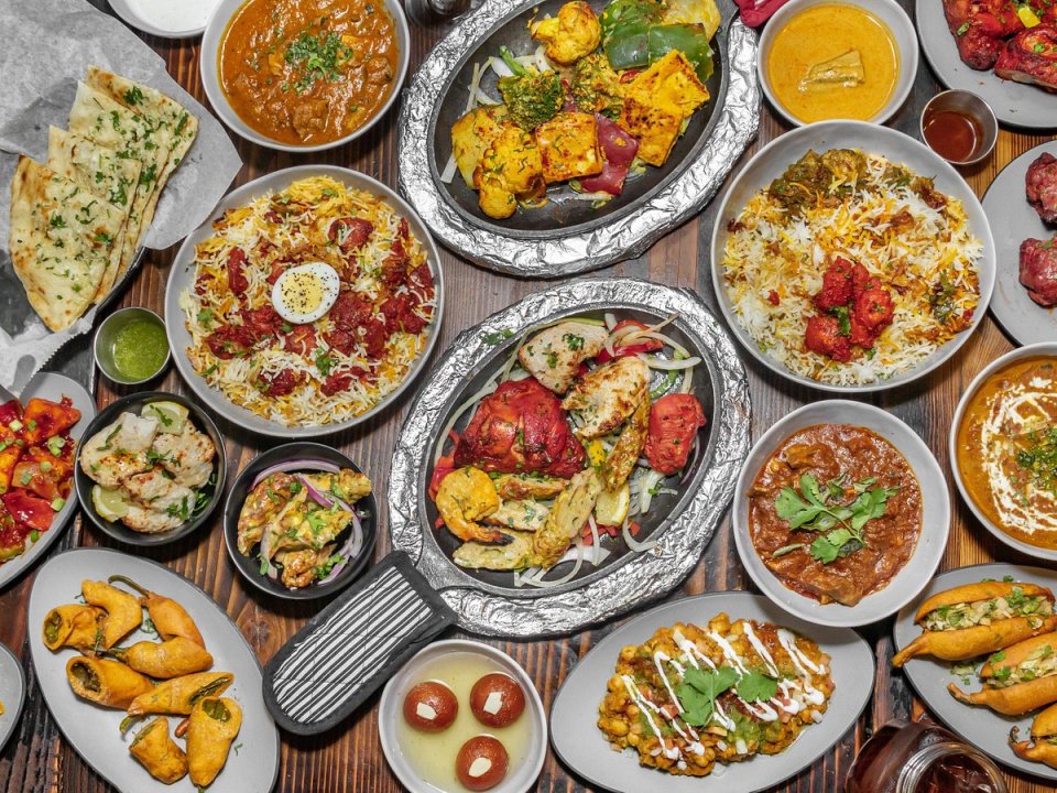 a variety of plates and bowls of food on a table
