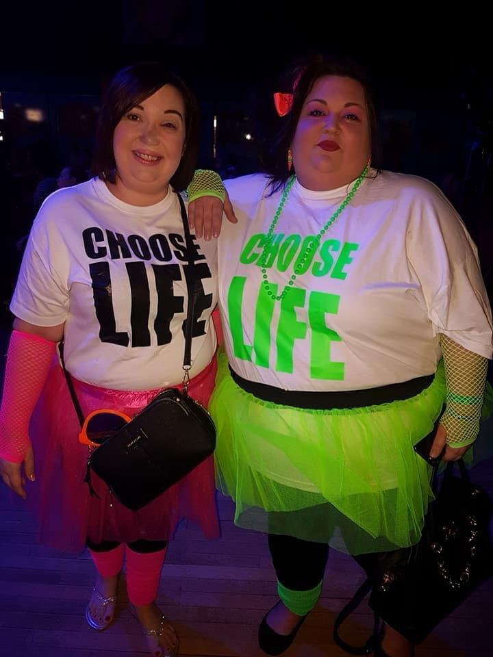 two women wearing shirts that say choose life