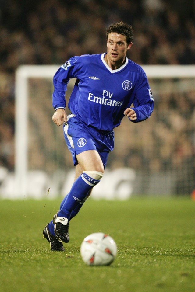 a man in a blue fly emirates jersey runs with the ball