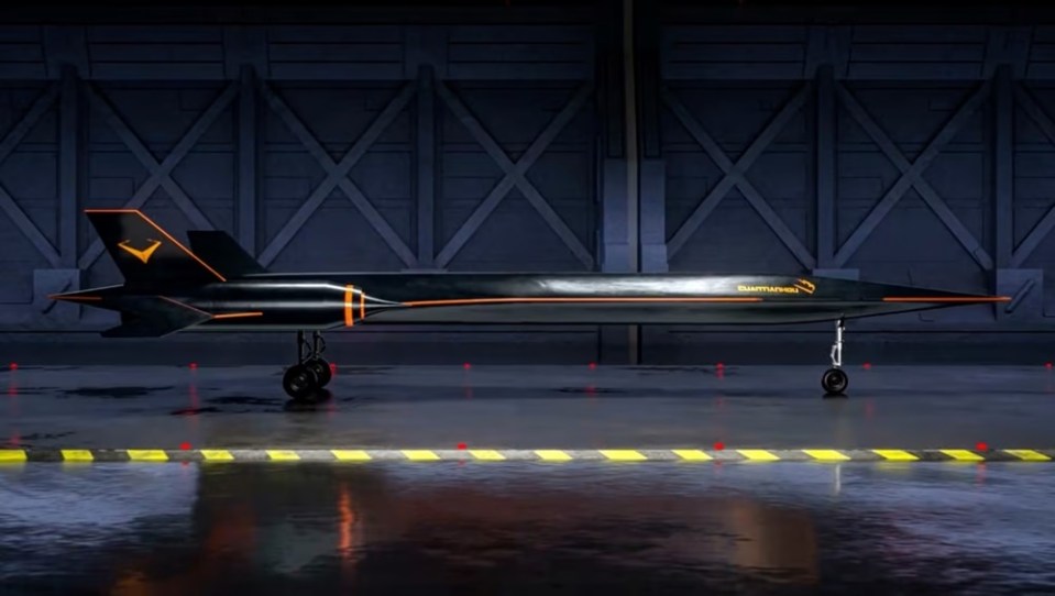 a black and orange stealth fighter jet is parked in a hanger