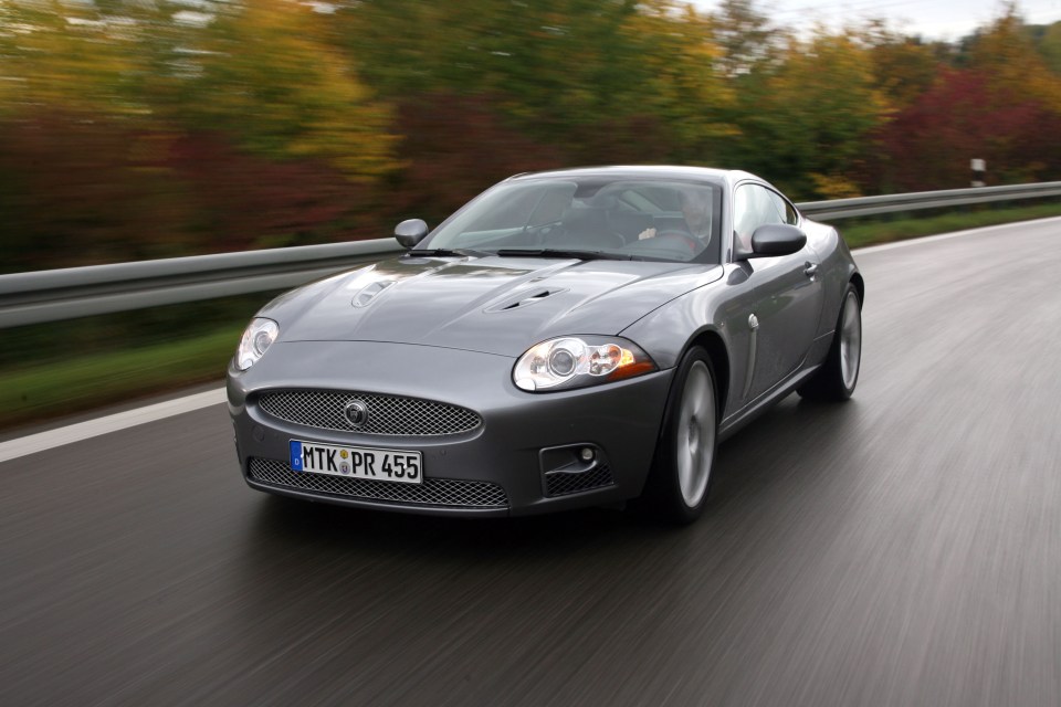 a jaguar car with a license plate that says mtkpr 455