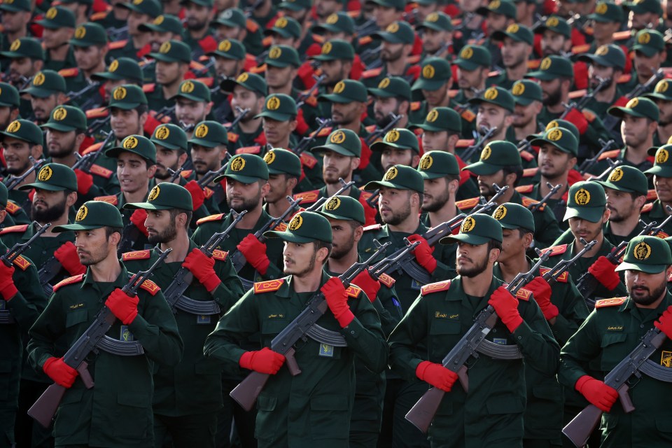 a group of soldiers are marching in a line and one of the soldiers has a name that starts with the letter m