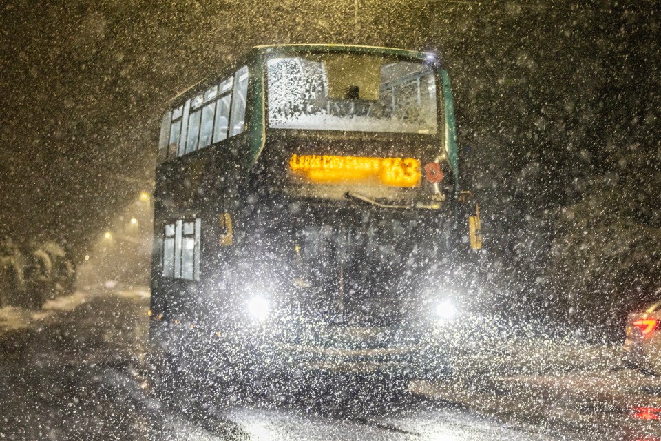 a double decker bus with the number 53 on it