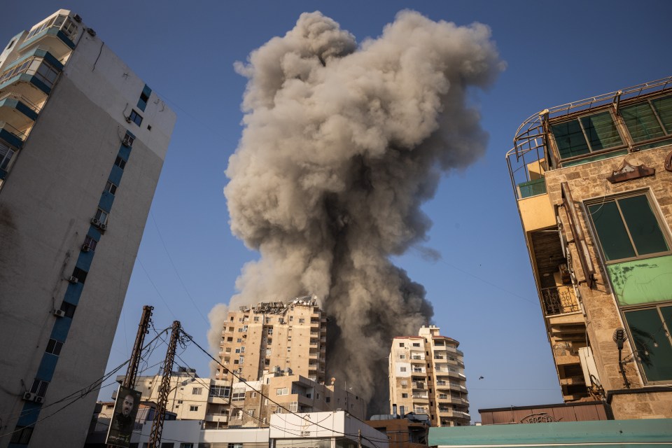 smoke coming out of a building with a sign that says ' a ' on it