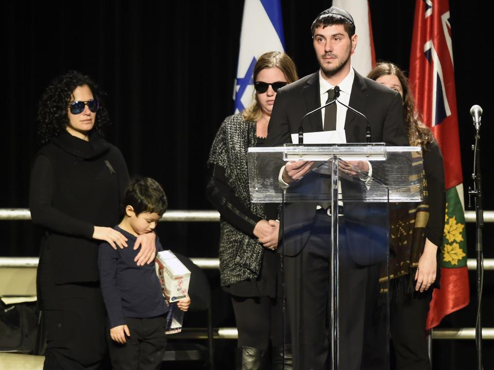 a man stands at a podium giving a speech