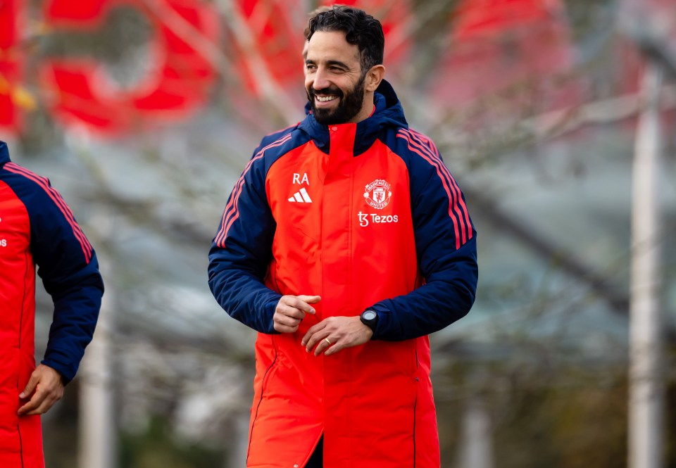 a man wearing a red jacket with the name ra on it